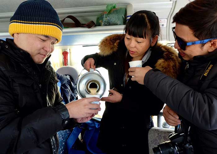 Day 8  Yangpachen Monastery, with Tibetan mastiffs keeping guard, overlooks part of the Trans-Himalaya range.
